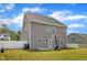 Spacious backyard with lawn and a view of the home and neighborhood at 5525 Garnet Meadow Rd, Knightdale, NC 27545