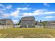 Expansive backyard featuring a lush green lawn and a view of the surrounding homes at 5525 Garnet Meadow Rd, Knightdale, NC 27545