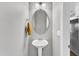 Well-lit powder room featuring pedestal sink, modern fixtures, and neutral wall color at 5525 Garnet Meadow Rd, Knightdale, NC 27545