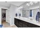 Bathroom featuring a double vanity, soaking tub, and walk-in closet at 5525 Garnet Meadow Rd, Knightdale, NC 27545