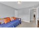 Spare bedroom featuring a full bed and carpeted floor at 5525 Garnet Meadow Rd, Knightdale, NC 27545