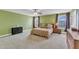 Spacious bedroom suite with generous carpeted floors, natural light, and neutral decor at 5525 Garnet Meadow Rd, Knightdale, NC 27545