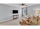Relaxing bedroom with a ceiling fan, a comfortable chair, and a picturesque window view at 5525 Garnet Meadow Rd, Knightdale, NC 27545