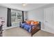 Spare bedroom featuring a full bed and carpeted floor at 5525 Garnet Meadow Rd, Knightdale, NC 27545