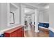 Elegant foyer featuring hardwood floors, decorative columns, and views into the dining and living spaces at 5525 Garnet Meadow Rd, Knightdale, NC 27545