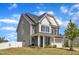 Stunning two-story home featuring a well-maintained lawn, mature landscaping, and a two-car garage at 5525 Garnet Meadow Rd, Knightdale, NC 27545