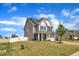 Attractive two-story home with a manicured lawn, white fence, and a two-car garage at 5525 Garnet Meadow Rd, Knightdale, NC 27545