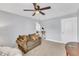 Inviting living room with a ceiling fan and a stairway view at 5525 Garnet Meadow Rd, Knightdale, NC 27545