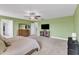 Spacious main bedroom featuring a ceiling fan and carpeted floors at 5525 Garnet Meadow Rd, Knightdale, NC 27545