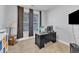 Functional home office space with a desk, storage, and a window offering natural light at 5525 Garnet Meadow Rd, Knightdale, NC 27545