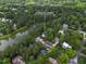 Aerial view of 6 Chelan Ct Durham with lake views and wooded surroundings at 6 Chelan Ct, Durham, NC 27713