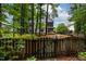 Large backyard with a wooden fence and lush landscaping at 6 Chelan Ct, Durham, NC 27713
