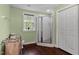 Bright bathroom with tiled shower and storage at 6 Chelan Ct, Durham, NC 27713