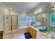 Bright bathroom features a double vanity, walk-in shower, and separate soaking tub at 6 Chelan Ct, Durham, NC 27713