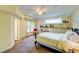 Comfortable bedroom with a ceiling fan, built-in shelves, and soft carpet for a restful atmosphere at 6 Chelan Ct, Durham, NC 27713