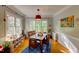 Comfortable dining area with natural lighting, hardwood floors, and modern decor at 6 Chelan Ct, Durham, NC 27713