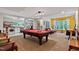 Spacious game room with pool table, laundry and kitchenette at 6 Chelan Ct, Durham, NC 27713