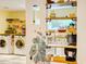 Bright kitchen with open shelves and a handy laundry area, offering both functionality and style for modern living at 6 Chelan Ct, Durham, NC 27713