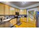 Cozy kitchen featuring stainless steel appliances, dark countertops, and ample cabinetry at 6 Chelan Ct, Durham, NC 27713