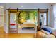 Main bedroom with mural backdrop and sliding barn doors looking into the living room at 6 Chelan Ct, Durham, NC 27713