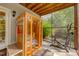 Enclosed screened porch features an infrared sauna and workout equipment at 6 Chelan Ct, Durham, NC 27713