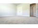 Bedroom with neutral carpet, a double-door closet, and open doorway at 600 Sweet Potato Lane # 38, Nashville, NC 27856