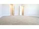 Spacious bedroom featuring neutral carpet and adjoining walk-in closet at 600 Sweet Potato Lane # 38, Nashville, NC 27856