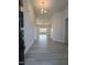 Inviting entryway with modern light fixture and beautiful hard surface floors at 600 Sweet Potato Lane # 38, Nashville, NC 27856