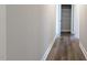 Hallway featuring wood-look floors and a linen closet for storage at 600 Sweet Potato Lane # 38, Nashville, NC 27856