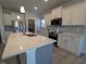 Modern kitchen with quartz countertops, stainless appliances, and a walk-in pantry at 600 Sweet Potato Lane # 38, Nashville, NC 27856
