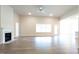 Spacious living room with fireplace, ceiling fan, and plenty of natural light at 600 Sweet Potato Lane # 38, Nashville, NC 27856