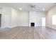 Large living room with fireplace, ceiling fan, wood-look flooring and neutral walls at 600 Sweet Potato Lane # 38, Nashville, NC 27856