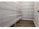 Walk-in pantry with multiple wire shelves and wood-look flooring at 600 Sweet Potato Lane # 38, Nashville, NC 27856