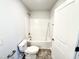 Bright bathroom equipped with a shower-tub combo and modern fixtures at 606 Melrose Ct, Sanford, NC 27330