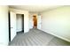 Well-lit bedroom with a closet for storage and neutral carpeting at 606 Melrose Ct, Sanford, NC 27330