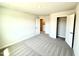 Inviting bedroom with closet space and neutral, plush carpeting at 606 Melrose Ct, Sanford, NC 27330