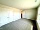 A spacious bedroom with double closets and plush neutral carpeting at 606 Melrose Ct, Sanford, NC 27330