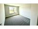 Comfortable carpeted bedroom featuring a window that provides plenty of natural light at 606 Melrose Ct, Sanford, NC 27330
