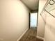 Long walk-in closet with carpeted floors and shelving, perfect for organized storage at 606 Melrose Ct, Sanford, NC 27330
