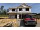 Exterior view of the home under construction with the frame partially completed at 606 Melrose Ct, Sanford, NC 27330