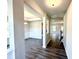 Inviting foyer with hardwood flooring, a view of the dining room, and a glimpse of the staircase at 606 Melrose Ct, Sanford, NC 27330