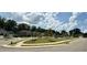 A quiet street view of newly built homes with sidewalks and carefully manicured lawns and landscaping at 606 Melrose Ct, Sanford, NC 27330