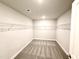 Spacious walk-in closet has wire shelving and carpet at 606 Melrose Ct, Sanford, NC 27330
