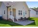 Exterior view showcases the backyard patio and well-maintained lawn, creating an inviting outdoor space at 608 W Godwin St, Dunn, NC 28334