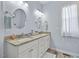 Bright bathroom with double sink vanity and granite countertops at 608 W Godwin St, Dunn, NC 28334