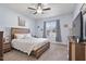 Comfortable bedroom with natural light from the window and a ceiling fan at 608 W Godwin St, Dunn, NC 28334