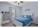 Bedroom with window view, a white bed, and ceiling fan at 608 W Godwin St, Dunn, NC 28334