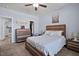 Cozy bedroom featuring a ceiling fan, comfortable carpet, and a stylish bed at 608 W Godwin St, Dunn, NC 28334