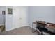 Bedroom with view to closet and desk with an office chair at 608 W Godwin St, Dunn, NC 28334
