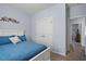 Comfortable bedroom features a full bed, carpet, and a decorative floral display above the headboard at 608 W Godwin St, Dunn, NC 28334